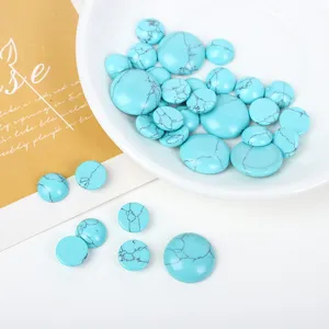 Macro detail of round turquoise cabochons with black veins for DIY jewelry making