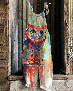 Close-up detail of the vibrant watercolor owl print on the artistic linen cotton jumpsuit.