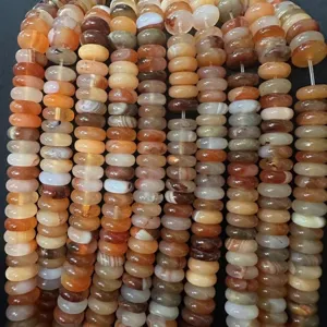 Close-up macro detail showing natural agate stone spacer beads for DIY jewelry making