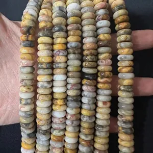 Detailed macro view of 4x10mm mixed natural stone abacus spacer beads for DIY jewelry crafts.