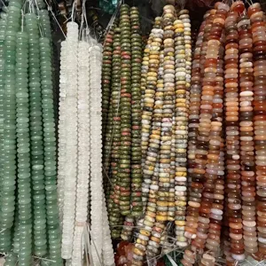 Close-up view of 4x10mm natural stone rondelle spacer beads for DIY jewelry making crafts