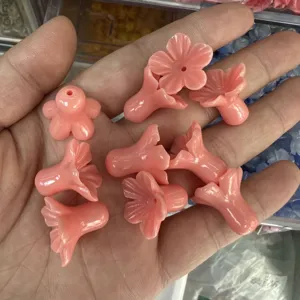 Detailed view of pink shell powder morning glory beads for DIY jewelry crafts handmade
