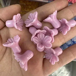 Detailed close-up showing pink shell powder pressed trumpet flower beads for DIY accessories