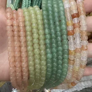 Close-up of assorted 6-10mm natural stone barrel beads for DIY jewelry