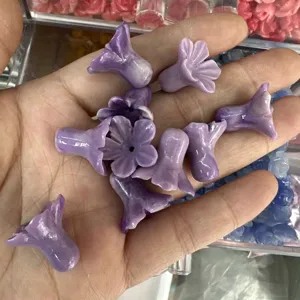 Detailed macro shot of purple shell powder pressed morning glory flower beads for DIY crafts