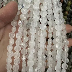 Macro view of clear faceted round natural stone quartz beads for DIY jewelry making