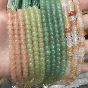 Close-up view of multi-colored natural stone barrel beads for DIY jewelry making