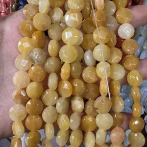 Macro view of faceted yellow natural stone round beads for DIY jewelry making