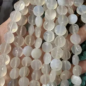 Close-up of translucent natural white agate faceted disk beads for DIY jewelry making crafts