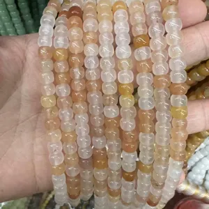 Macro detail of semi-translucent natural yellow quartz drum beads for DIY jewelry accessories