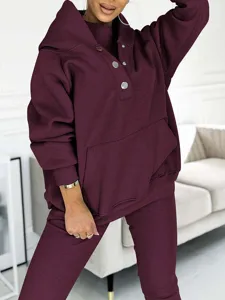 Burgundy hoodie set detail view showcasing cozy thick fabric, metal snap buttons, and ribbed pants.