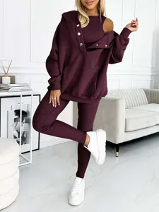 Detail view of women casual 3-piece tracksuit in burgundy featuring ribbed fabric and hoodie.