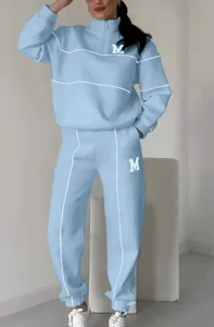 Women light blue half-zip sweatshirt sweatpants tracksuit set with white piping and M print.
