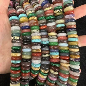 Macro view of colorful natural stone spacer beads including agate and crystal for DIY jewelry