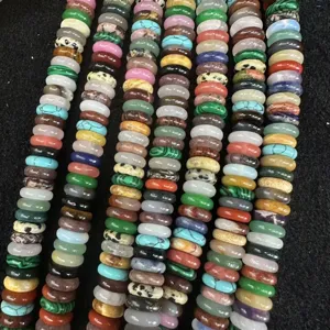 Detailed view of assorted natural stone spacer beads including agate and crystal for DIY jewelry