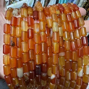 Macro view of orange carnelian cylindrical beads for DIY jewelry making
