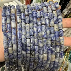Close-up of blue and white marble-patterned natural stone cylindrical beads for DIY jewelry