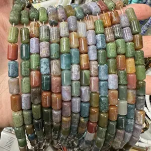 Macro detail of multi-color cylindrical natural agate stone beads for DIY jewelry crafting