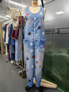 Vintage floral denim jumpsuit for women, stylish wide leg streetwear overalls, retro style.