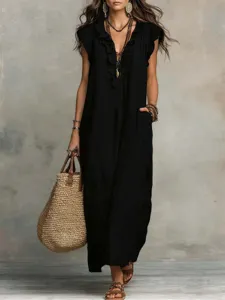 Close-up of the elegant V-neck ruffle trim and loose pocket detail on the maxi dress.