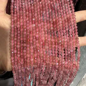 Macro detail view of faceted natural pink strawberry quartz beads for DIY jewelry making