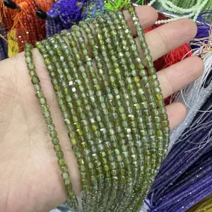 Detailed close-up of shiny green faceted square zircon loose beads for DIY jewelry crafts