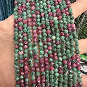 Close-up of faceted natural ruby zoisite stone beads for DIY jewelry making
