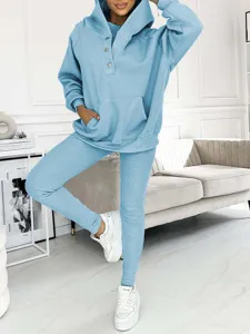Detailed view of the light blue ribbed three-piece tracksuit, highlighting soft texture and stylish fit.