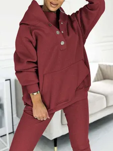 Detail view of women's casual 3-piece tracksuit featuring a hooded sweatshirt, vest, and pants.