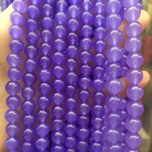 Close-up of light purple natural chalcedony loose beads for DIY jewelry making