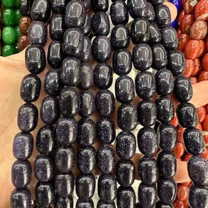 Macro view of glittering blue sandstone barrel beads for DIY jewelry making accessories