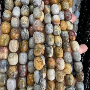 Macro detail of natural agate barrel beads with unique earth-tone textures for DIY jewelry