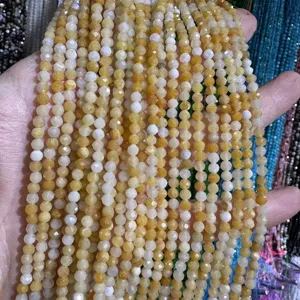 Close-up of yellow and white faceted natural stone beads for DIY jewelry making