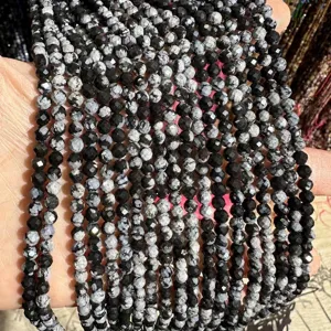 Macro detail of faceted snowflake obsidian natural stone beads for DIY jewelry making