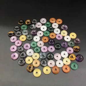 Selection of 15mm natural stone donut pendants in multiple colors for jewelry making