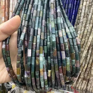 Close-up of 4x9mm multi-colored natural stone cylinder beads for jewelry making