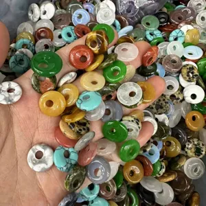 Assorted colorful natural stone donut beads for DIY jewelry making and craft projects