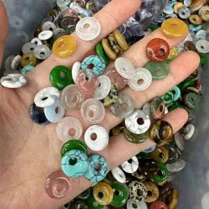 Macro view of various natural stone agate crystal donut beads for jewelry making