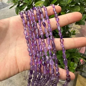 Macro detail of irregular purple amethyst nugget beads for DIY jewelry making