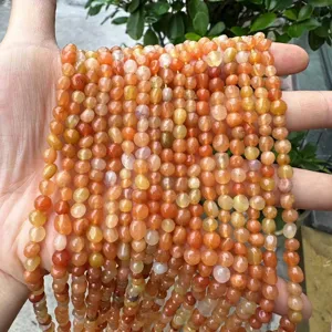 Macro view of 4-6mm irregular orange natural stone beads strands for DIY jewelry making