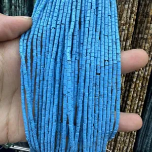 Macro detail of 2x2mm blue cylindrical natural stone spacer beads for jewelry DIY