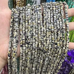 Detailed view of 3mm natural Dalmatian jasper stone cube beads for jewelry making