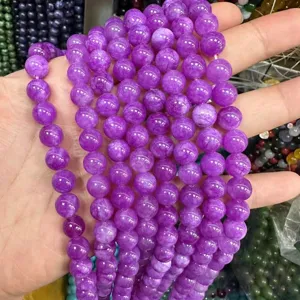 Macro detail of 8mm purple round stone beads strands for DIY jewelry making and crafting
