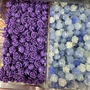 Macro view of DIY shell powder purple and blue 3D rose flower beads with cross-holes