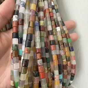 Close-up of 6x6mm mixed natural stone tube beads for DIY jewelry making