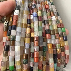 Close-up of 6x6mm tube-shaped natural stone beads in various colorful assortments