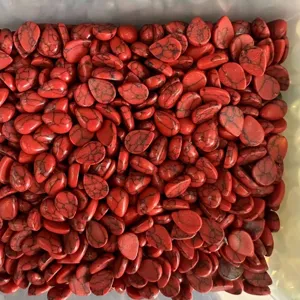 Detailed close-up of red teardrop stone cabochons with black veins for DIY jewelry