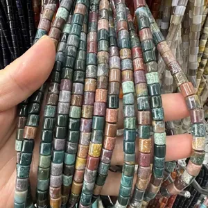 Close-up of 6x6mm natural stone cylinder beads in various earthy colors for DIY jewelry