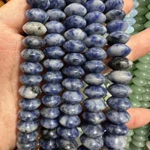 Close-up of blue and white mottled natural stone flying saucer beads for DIY jewelry making