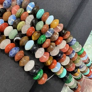 Detailed view of colorful natural stone disk-shaped spacer beads for DIY jewelry making